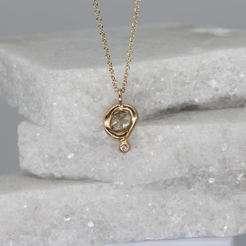 Rough diamond pendant necklace with diamond set tear drop