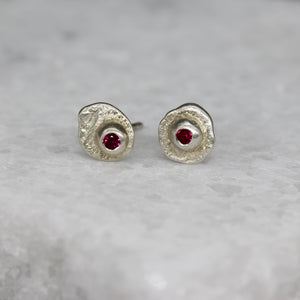 Oddity sculptural ear studs in 9ct white gold set with rubies