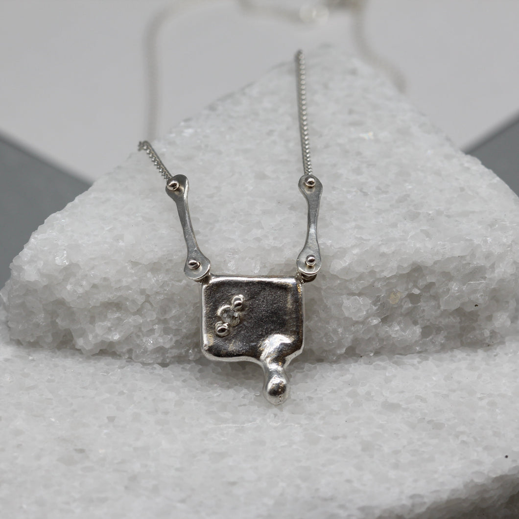 Moissanite and sterling silver square pendant