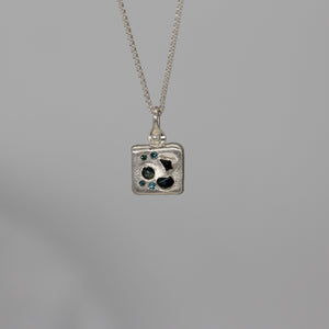 Sapphire and diamond square composition pendant necklace in sterling silver by Tamara Gomez