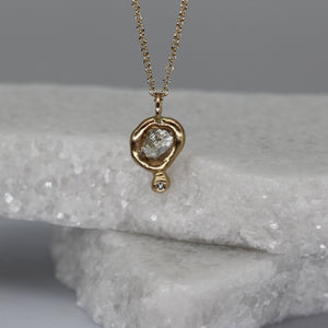Rough diamond pendant necklace with diamond set tear drop