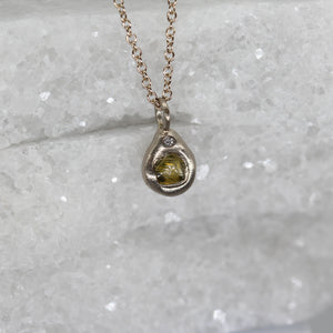 Rough green diamond pendant necklace in white gold and tiny diamond detail by Tamara Gomez