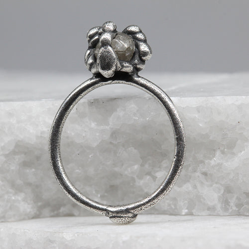 Rough diamond infection ring in sterling silver by Tamara Gomez