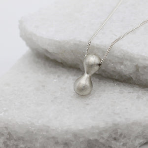 Large infinity pendant necklace in sterling silver by Tamara Gomez