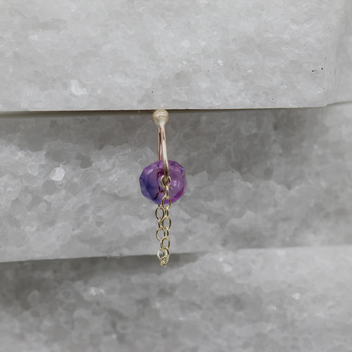 Single purple sapphire earring in yellow gold with chain detail by Tamara Gomez	