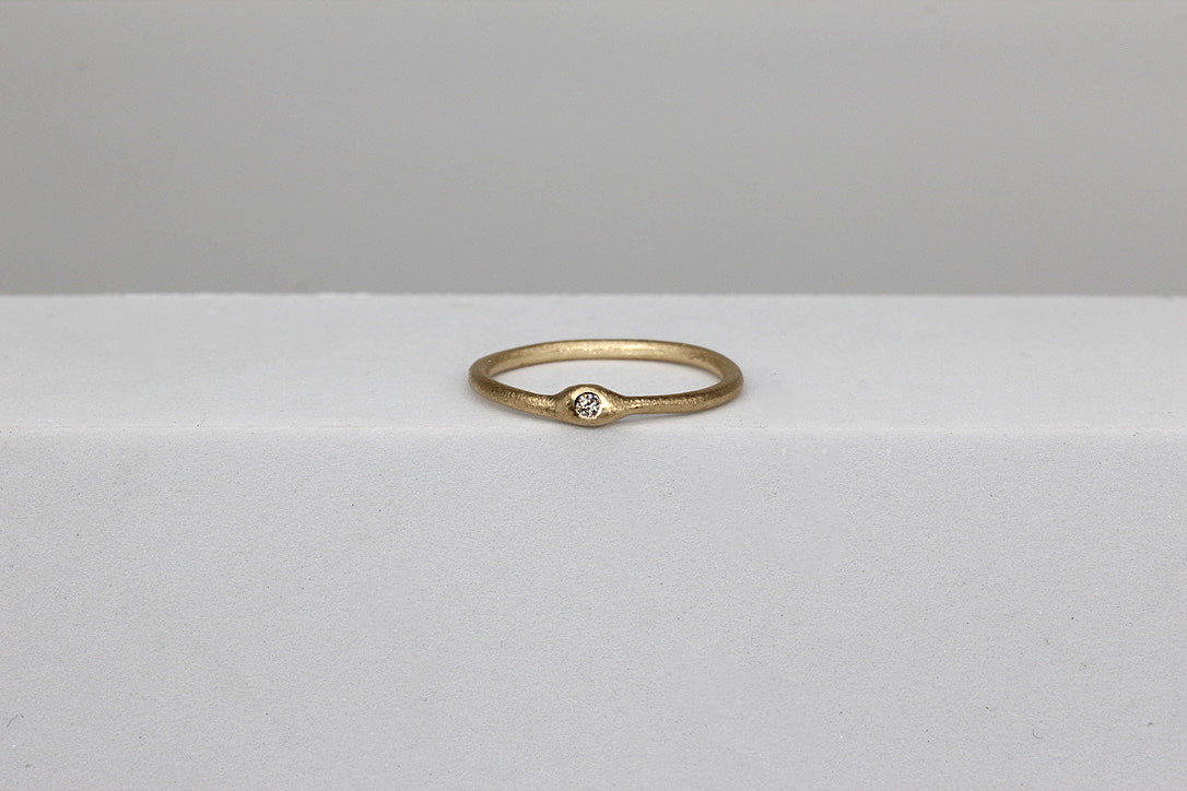 Slim pebble diamond set ring in yellow gold by Tamara Gomez