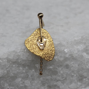 Single diamond slice stud earring in yellow gold with chain by Tamara Gomez