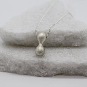 Extra large infinity pendant necklace in sterling silver by Tamara Gomez