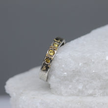 Load image into Gallery viewer, Side view of yellow sapphire three stone ring in sterling silver