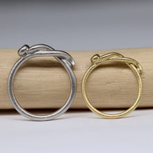 Load image into Gallery viewer, Pair of bespoke snake rings with diamond set heads in gold and platinum by Tamara Gomez