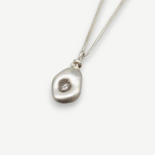Load image into Gallery viewer, Rough diamond talisman pendant in sterling silver set with a 0.40 carat natural grey rough diamond, handcrafted in London by Tamara Gomez.
