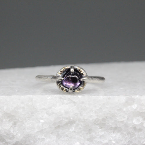 Purple sapphire ring in sterling silver with flecks of 18ct gold, featuring a hand cut Sri Lankan sapphire, handcrafted in London by Tamara Gomez.