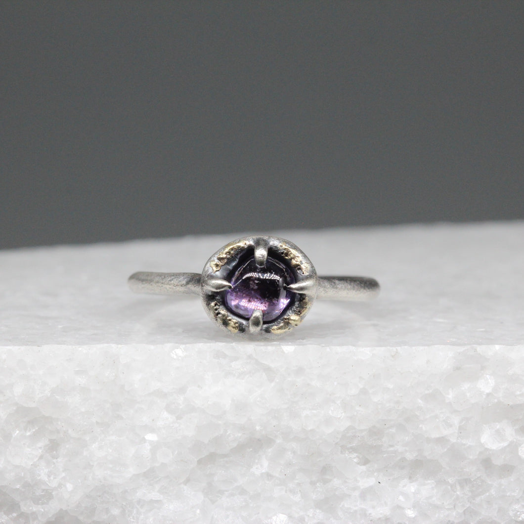 Purple sapphire ring in sterling silver with flecks of 18ct gold, featuring a hand cut Sri Lankan sapphire, handcrafted in London by Tamara Gomez.