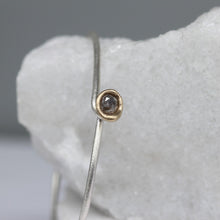 Load image into Gallery viewer, Sterling silver oval bangle with molten set rose cut diamond in 14ct yellow gold, handcrafted by Tamara Gomez.