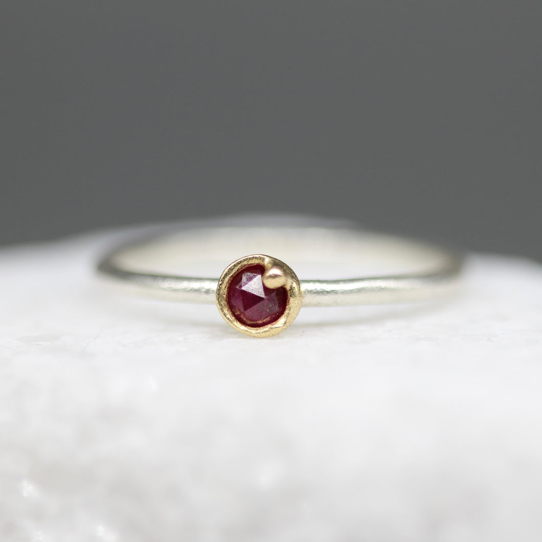 Rose cut ruby bud ring in 18ct yellow gold and sterling silver with tiny gold bauble detail, handcrafted in London by Tamara Gomez.

