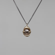 Load image into Gallery viewer, Sculptural rough diamond pendant in brushed gold on a fine blackened silver chain, handcrafted in London by Tamara Gomez.