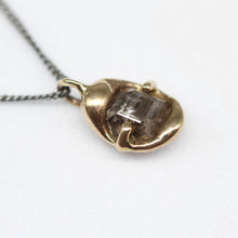 Load image into Gallery viewer, Sculptural rough diamond pendant in brushed gold on a fine blackened silver chain, handcrafted in London by Tamara Gomez.