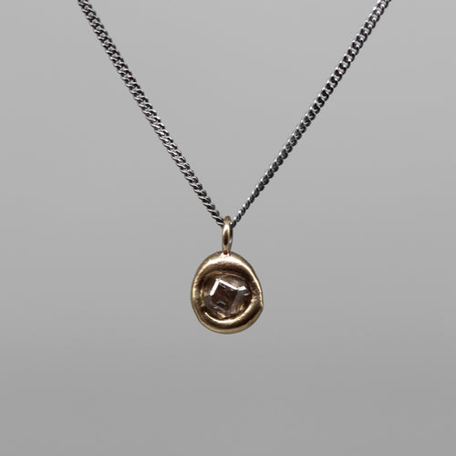 Sculptural 0.5ct rough diamond pendant in brushed gold on fine blackened silver chain, handcrafted in London by Tamara Gomez.