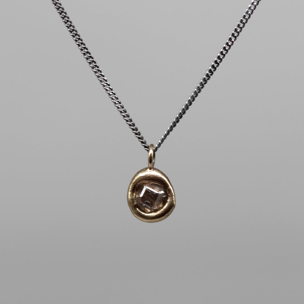 Sculptural 0.5ct rough diamond pendant in brushed gold on fine blackened silver chain, handcrafted in London by Tamara Gomez.