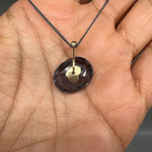 Load image into Gallery viewer, Inkwash blue watercolour sapphire sequin pendant necklace in 9ct yellow gold on a darkened sterling silver chain, handcrafted in London by Tamara Gomez.

