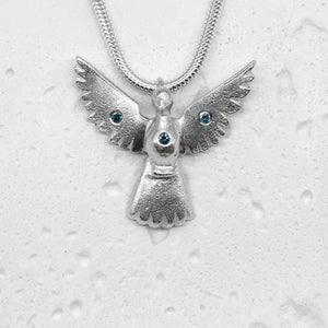 Dove pendant in Sterling Silver with blue diamonds